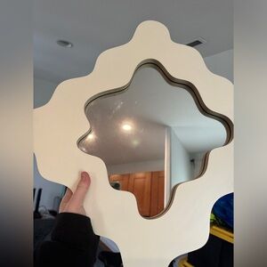 Small wavy cut mirror. Cream color. Like new.